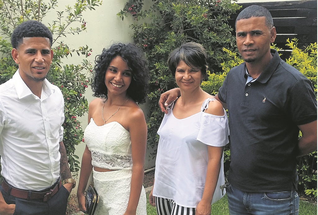 Keagan Dolly (left) with his sister Ravenique, mother Kim and father Ramon.   Photos from Dolly family album 