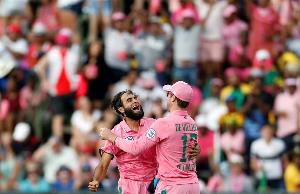 WINNING FEELING Imran Tahir is congratulated by his captain AB de Villiers after Tahir bowled out Sri Lanka's batsman Sachith Pathirana. Picture: Siphiwe Sibeko / REUTERS  
