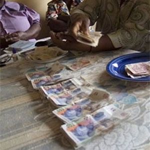 Stokvel members count money at a meeting in Nhlazuka. (Photo: File, John Robinson)