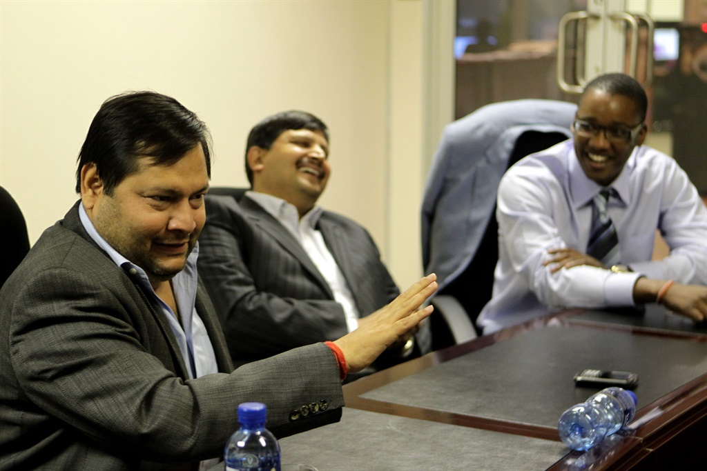 Ajay and Atul Gupta with Duduzane Zuma (then director of Sahara) in Midrand, 4 March 2011. (Gallo Images/Getty Images)
