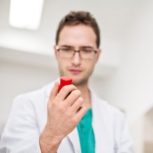Doctor examining medication – iStock