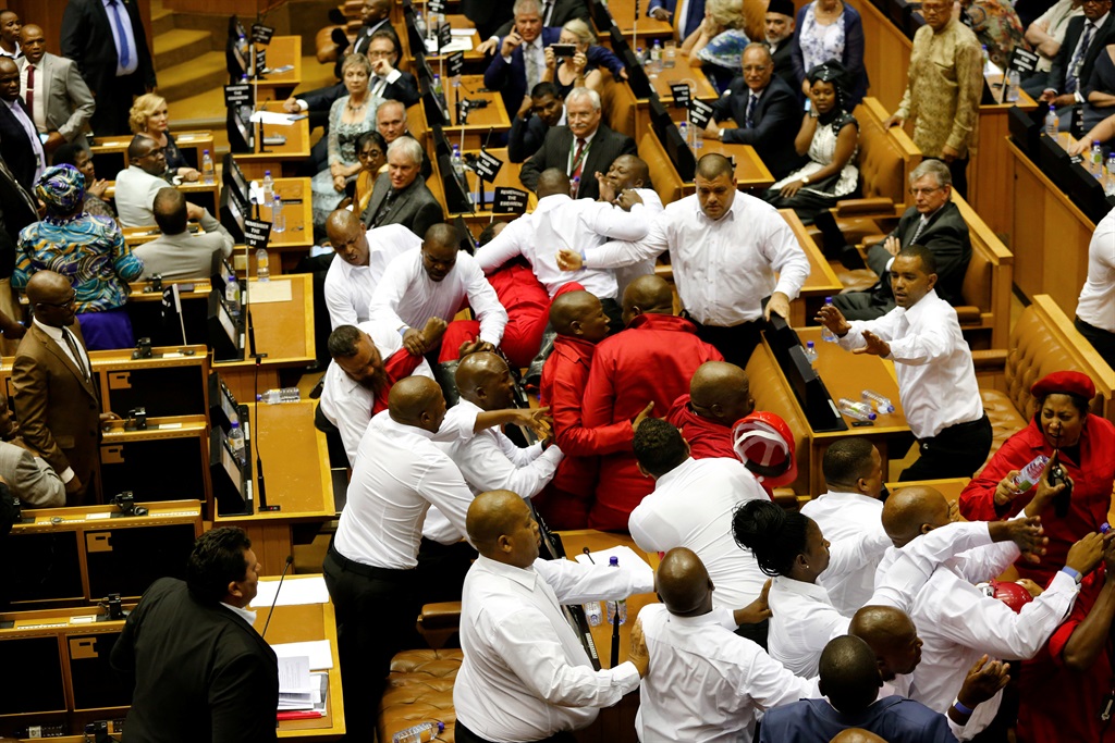  Security officials remove members of the Economic Freedom Fighters during President Jacob Zuma's State of the Nation Address in Cape Town on Thursday (February 9 2017). Picture: Sumaya Hisham/Reuters 