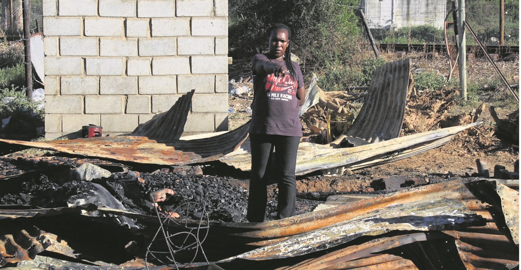 Portia Magoga of Blikkiesdorp in her burnt shack.  Photo by Phumlani Saul 