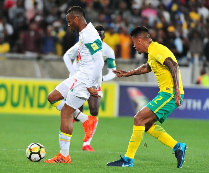 Diafra Sakho, who scored the opening goal, and Clayton Daniels of South Africa do battle during the 2018 Ffia World Cup Qualifier. Picture: Philip Maeta/Gallo Images
