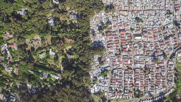  Johnny Miller, a photographer based in Cape Town, created a series of pictures using drones to display inequality in South Africa. This is a picture of Hout Bay and Imizamo Yethu. Picture: Johnny Miller  