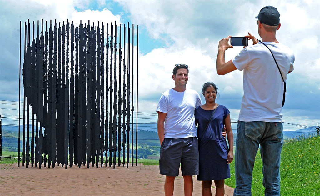 German tourists, Constantin Poetter and Miriam Braun pose for a photo taken by their fellow tourist, Eric Malycha, at the Nelson Mandela Capture Site outside Howick. Picture: Ian Carbutt