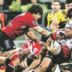 LOSING BATTLE:  Corné Fourie of the Lions is tackled in last year’s Super Rugby final against the Hurricanes. (Simon Watts, Getty Images)