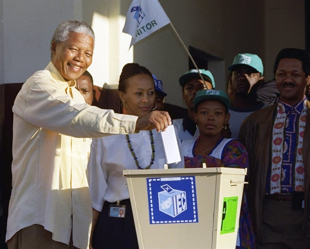 Nelson Mandela casts his vote at Ohlange High School hall in Inanda, 10 miles (15 kilometres) north of Durban, KwaZulu-Natal on 27 April 1994 