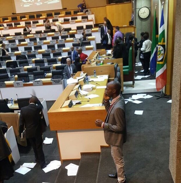 The chamber deserted and documents strewn all over the floor following the disruption. Picture: Twitter/ANCJoburgRegion