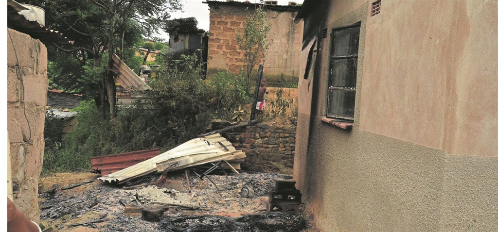 The house belonging to a suspected killer which was burnt by community members on Sunday.                Photo by Siyabonga Simelane