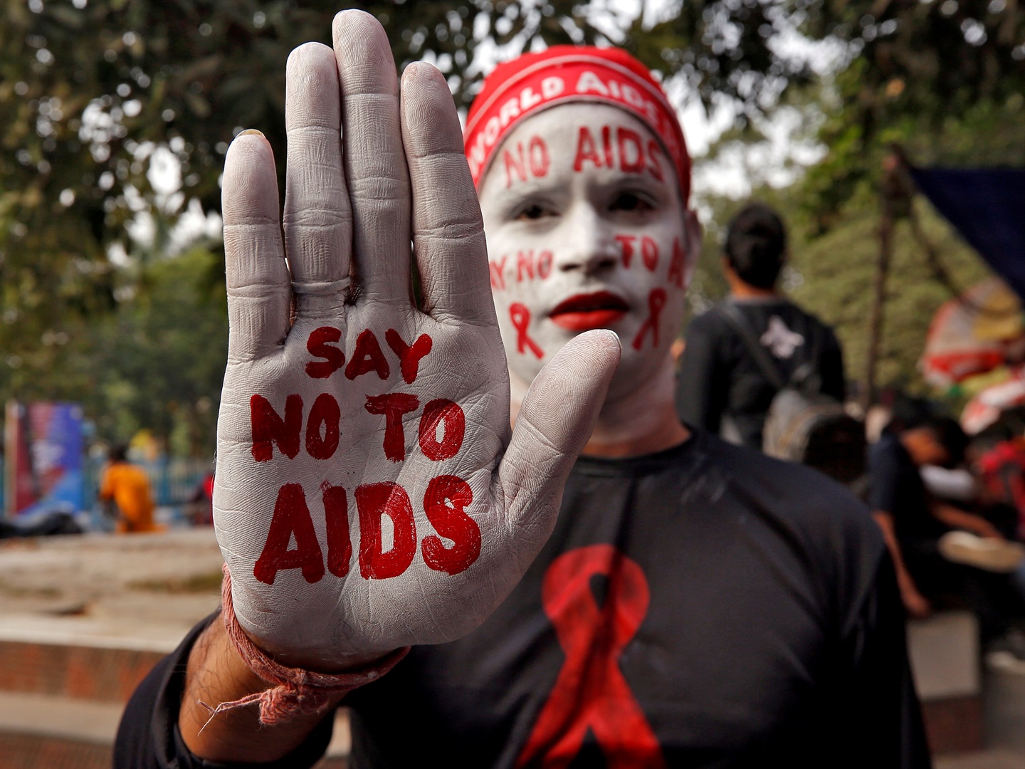A man during an HIV/AIDS awareness campaign the day before World AIDS Day in Kolkata, India. 