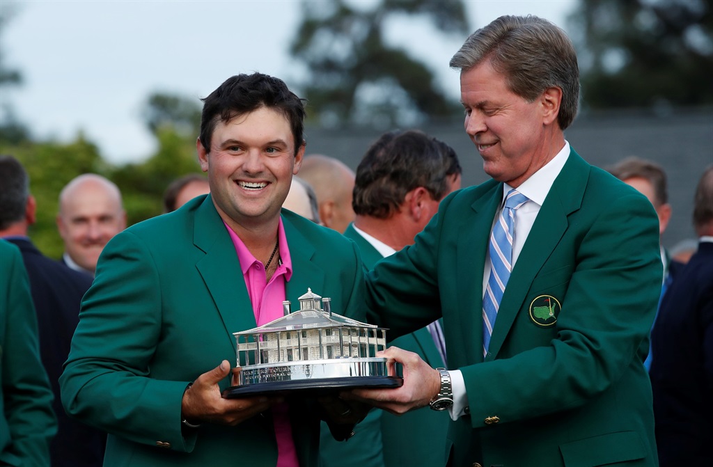 Chairman, Augusta National Golf Club and the "Masters" Tournament, Fred S. Ridley (R), presents Patrick Reed of the U.S. with the Masters Trophy after Reed won the 2018 Masters tournament at the Augusta National Golf Club in Augusta, Georgia, U.S. April 8, 2018.PHOTO: REUTERS/Brian Snyder