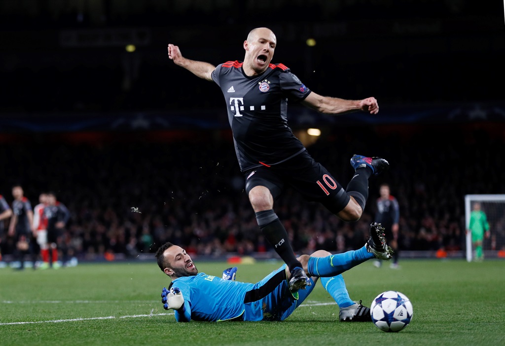 Bayern Munich's Arjen Robben jumps over the diving Arsenal goalkeeper David Ospina in Tuesday night’s Champions League match at the Emirates Stadium. Picture: Stefan Wermuth / REUTERS / Livepic