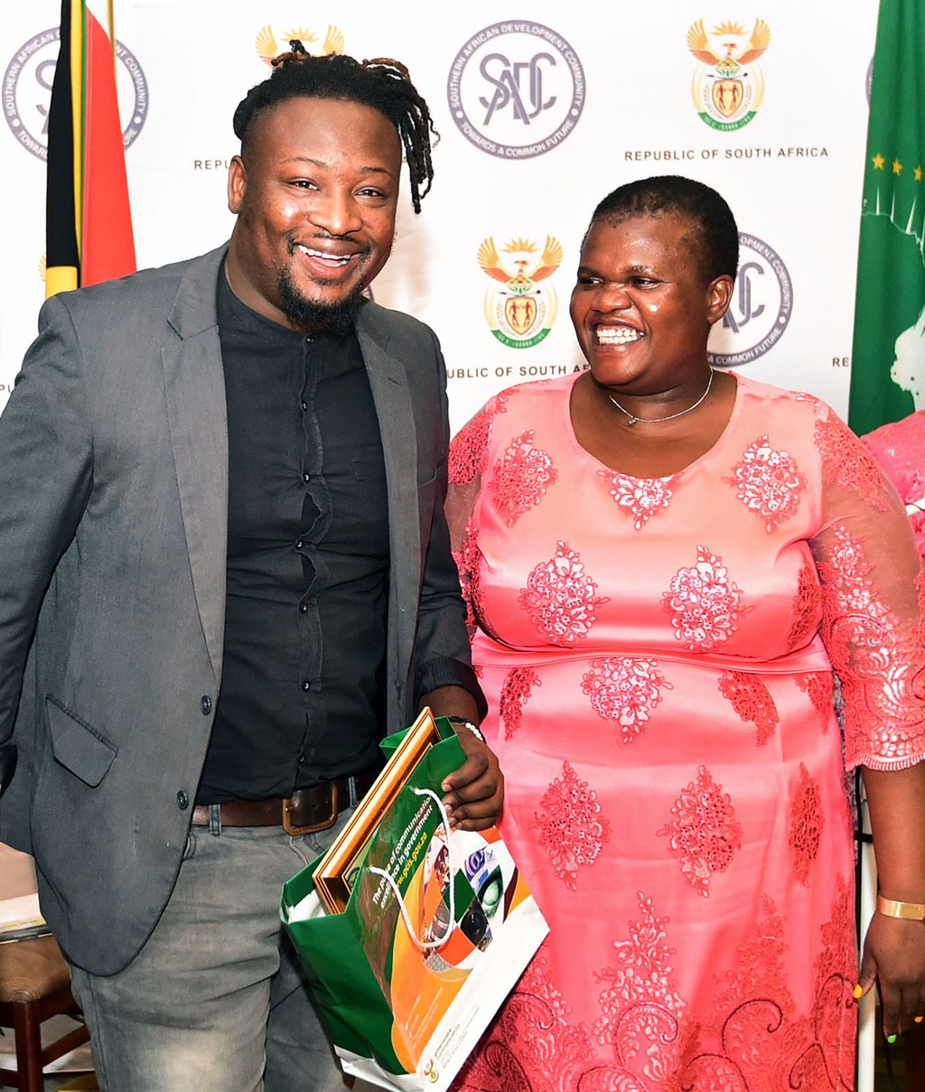 Communications Minister Faith Muthambi handing over the prize to City Press Photographer Leon Sadiki, the winner in Photojournalism category of SADC Media Awards held at Freedom Park in Pretoria. Picture: Kopano Tlape/GCIS 