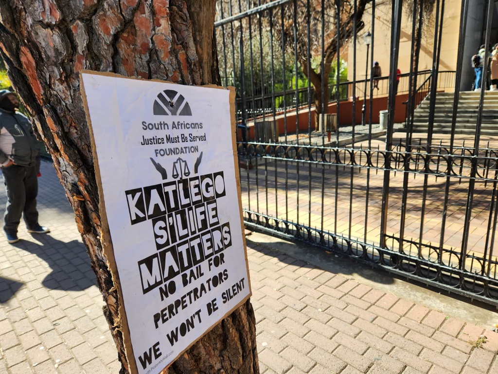 Placards calling for justice for Katlego Bereng, w