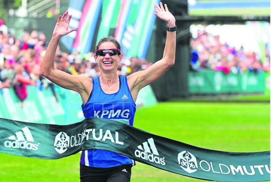 Caroline Wostman celebrates her win in last year’s Two Oceans 56km race in Cape Town. Photo by Backpagepix