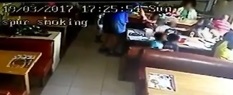 This video screengrab shows the man taking the girl’s arm and pulling her towards him.