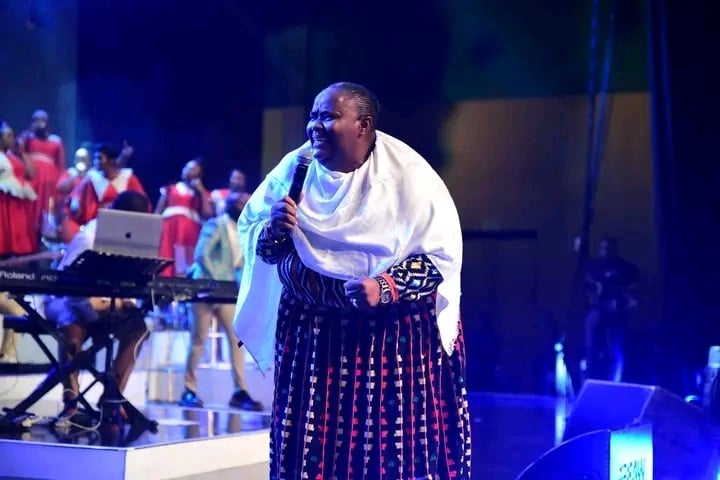  Legendary gospel musician Hlengiwe Mhlaba rocking a MaXhosa dress on stage.