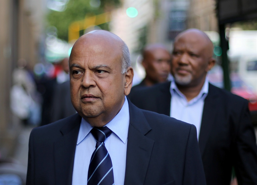 Finance Minister Pravin Gordhan walks with his deputy, Mcebisi Jonas, to the court hearing. Picture: Siphiwe Sibeko/Reuters