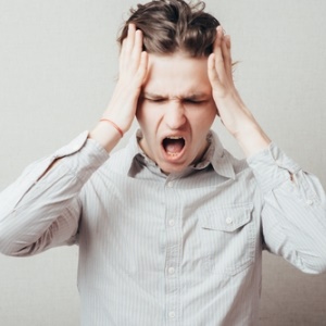 Boy with headache from Shutterstock