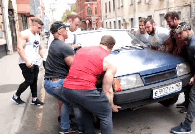 <b> MOVE OR ELSE WE MOVE YOU! </b> Russian youths move poorly parked vehicles with the help of beefed- gym enthusiasts. <i>Image: Youtube </i> 