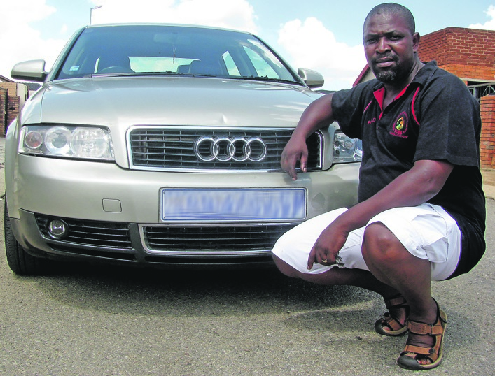 Harold Tshabalala poses with his car, My Baby Got a Number.Photo by Malereko Tae