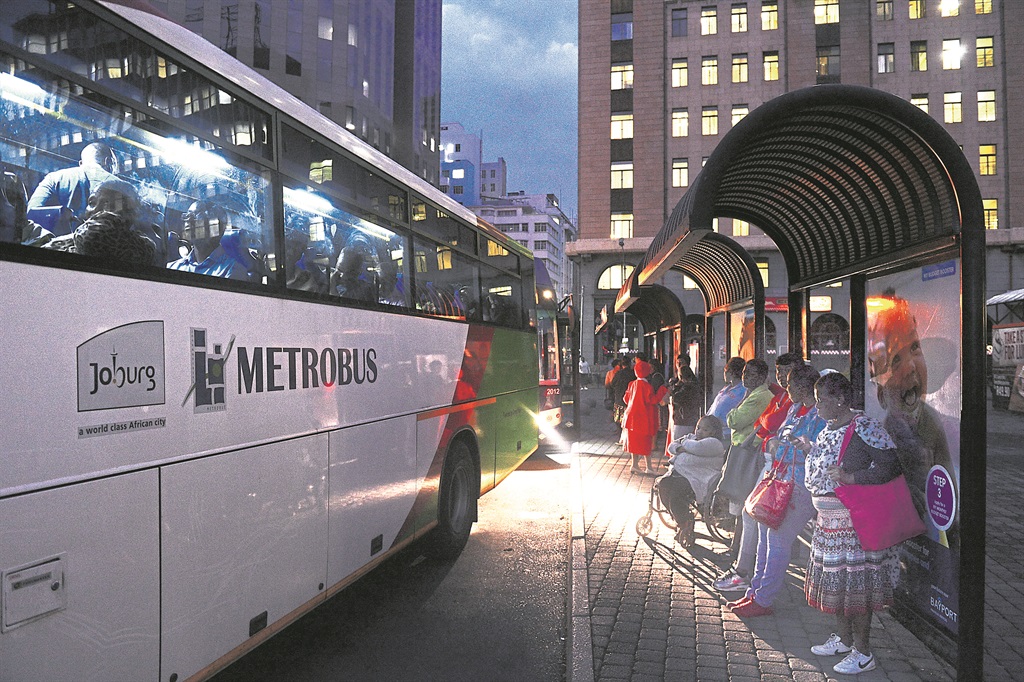 Commuters wait to take the next Metro bus at Ghandi square, Johannesburg. Picture: Leon Sadiki/City Press