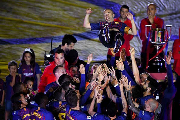 ndres Iniesta of FC Barcelona is tossed into the air by his team mates at the end of the La Liga match between Barcelona and Real Sociedad at Camp Nou 