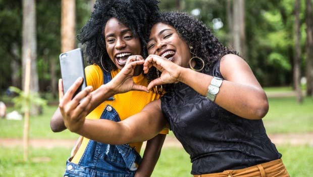 Young women enjoying the power of positive social media