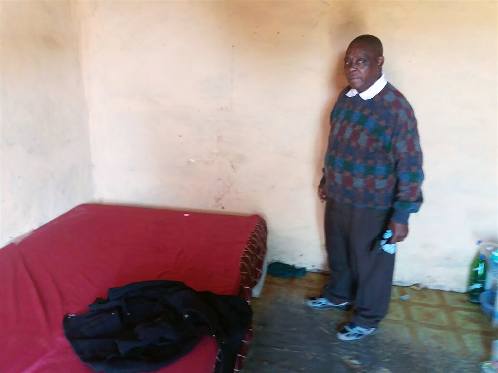 Nomfundo Mnyandu's father, Manesi standing next to her bed where other traces of blood were seen. Photo by Zimbili Vilakazi