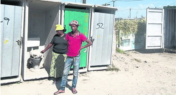 Noluvo Zweni (left) and Xolani Dastile say the toilets are a big health risk.   Photo by       Vincent Lali