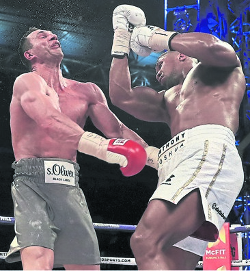 TAKE THAT: Wladimir Klitschko had no answer to this monster punch by new IBF, WBA and IBO heavyweight champion Anthony Joshua at Wembley on Saturday. Photo by Getty Images