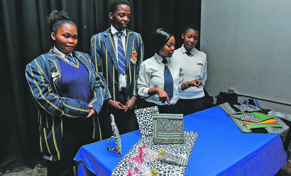 The Welkom High School enterprise club showing the various items they made, such as candle holders and bags crafted from old T-shirts. They won the competition last year.