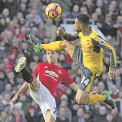 In the air:  Ander Herrera of Manchester United in action against Francis Coquelin of Arsenal in a previous Premier League match. (Getty Images)
