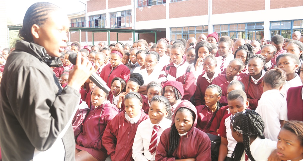 Pupils at Bothlabelo Secondary School listen to a career development services adviser from the Department of Higher Education and Training. 