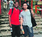 Lawrence Moshani (left) with a friend, in Japan, where he fulfils his dream of studying animation.