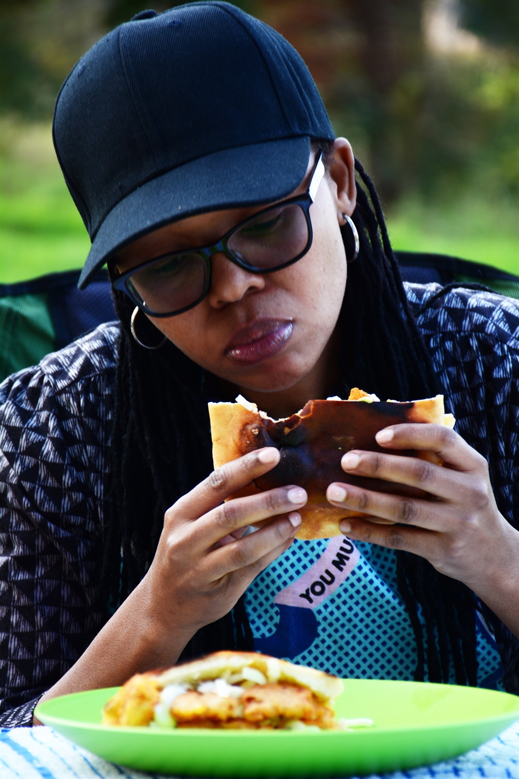 Chef Dee savours her cooked testicle creation. Photo by Dylan Mohlala
