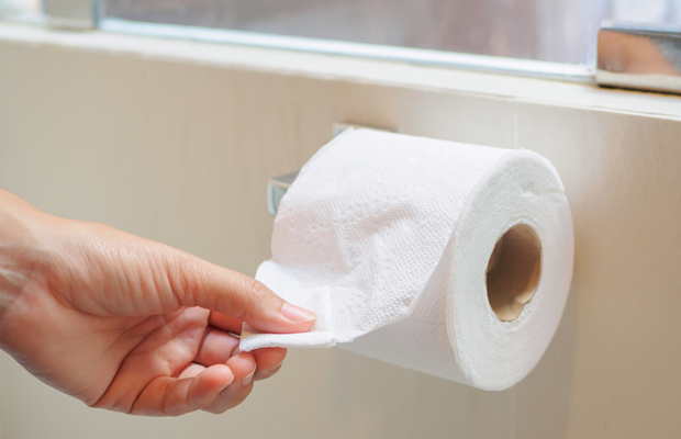 Person using toilet paper