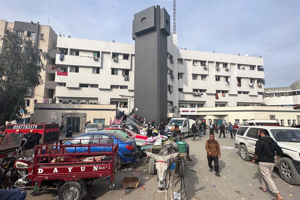 Displaced Palestinians gather in the yard of Gaza's Al-Shifa hospital on 10 December 2023, as battles continue between Israel and the militant group Hamas in the Palestinian territory. (AFP)