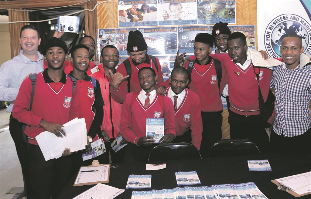 Holger Schonfeld (left, back), head of the College for Business and Maritime Studies, with a group of enthusiastic pupils during their roadshow event.          Photo by Thabo Monama
