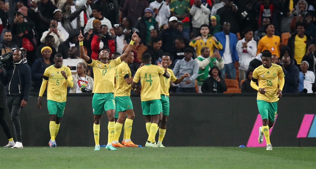 Zakhele Lepasa celebrates a goal with team-mates during the 2023 Africa Cup of Nations qualifiers match between South Africa and Morocco. 