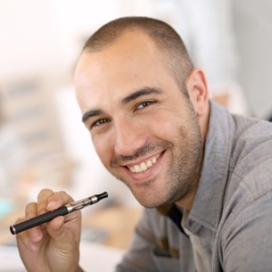 Guy smoking e-cigarette from Shutterstock