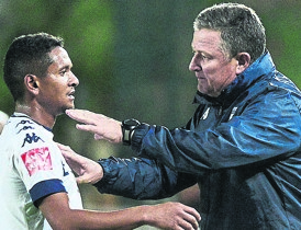 Bidvest Wits’ biggest achiever Daine Klate takes instructions from his coach Gavin Hunt  on the night they became PSL champions. Photo by Themba Makofane