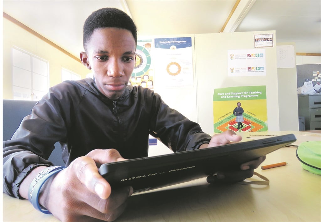 Meso Thekiso (18) says his tablet has made learning easier. Picture: Msindisi Fengu