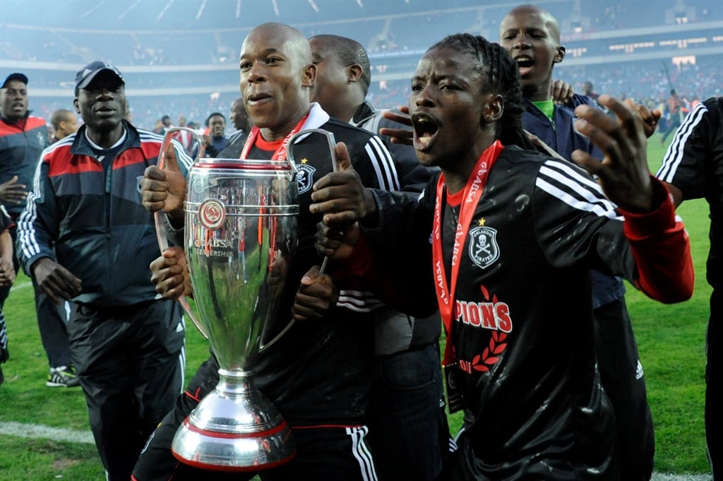Phenyo Mongala (right) won the treble with Orlando Pirates back in 2010/2011.