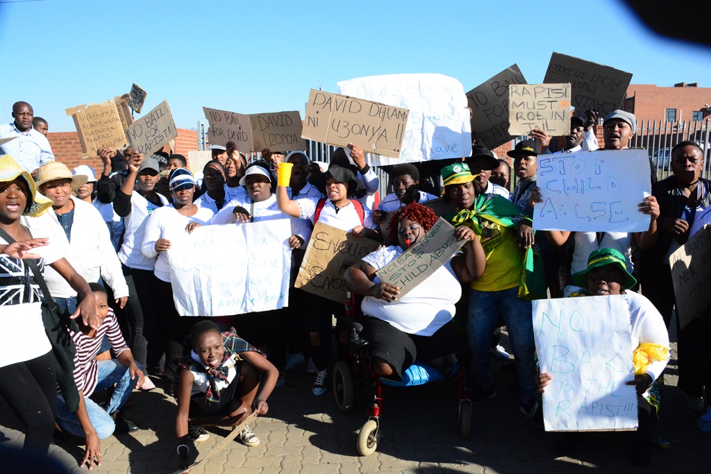 Residents of Tsakane ext 15 marched to the Tsakane magistrate court today after a 61-year-old man apparently raped his daughter. Photo by Stephens Molobi