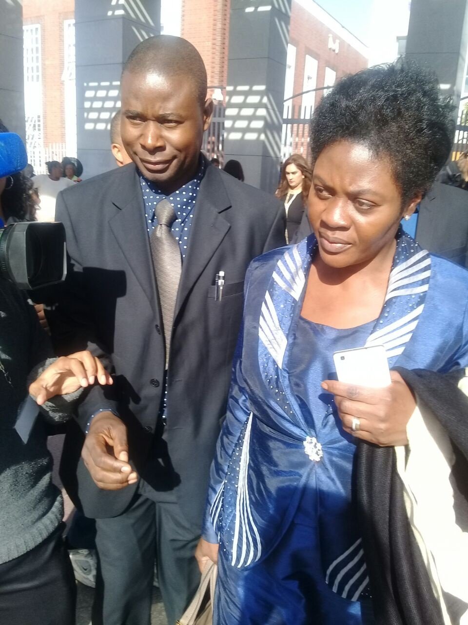 Taiwo Omotoso leaves the court with her Nigerian escort. Picture: Nosipiwo Manona