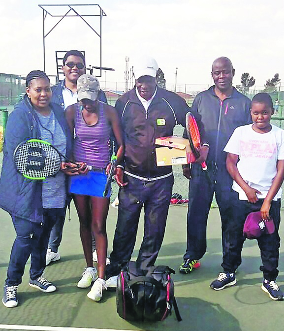 Samaritan: Wilfred Lepule (glasses) gives tennis gear to star Amukelani Mokone   Picture: Nhlanhla Mduna / Arthur ashe Tennis centre