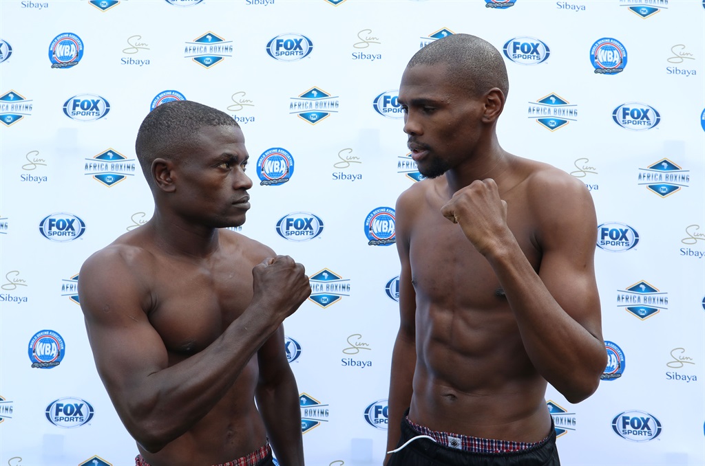 Sikho Nqothole (r) with Sunday Kiwale (l) face off for the Vacant WBA Pan African Super Flyweight Title during the 2018 Fox Africa Boxing 7 at the Sibaya Casino, Durban on 26 June 2018  Picture: Muzi Ntombela/BackpagePix