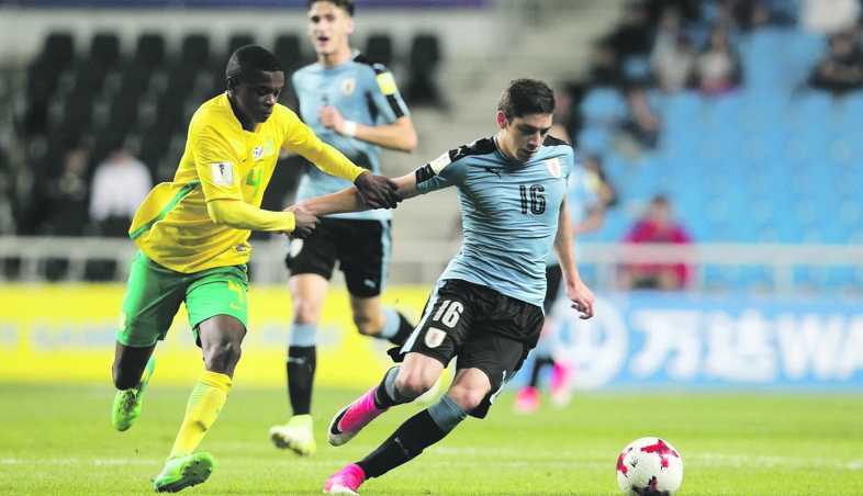 nowhere to go Federico Valverde of Uruguay and South Africa’s Teboho Mokoena during yesterday’s match PHOTO: Joern Pollex / FIFA via Getty Images